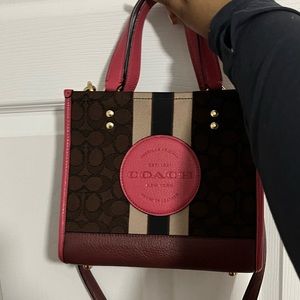 Pink and brown coach Dempsey bag